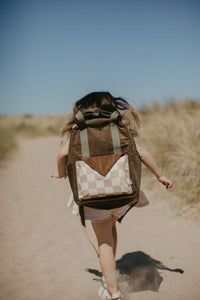Person walking on a path with a large backpack